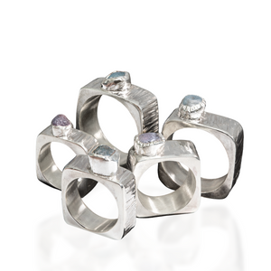 Square hollowform ring with single raw sapphire