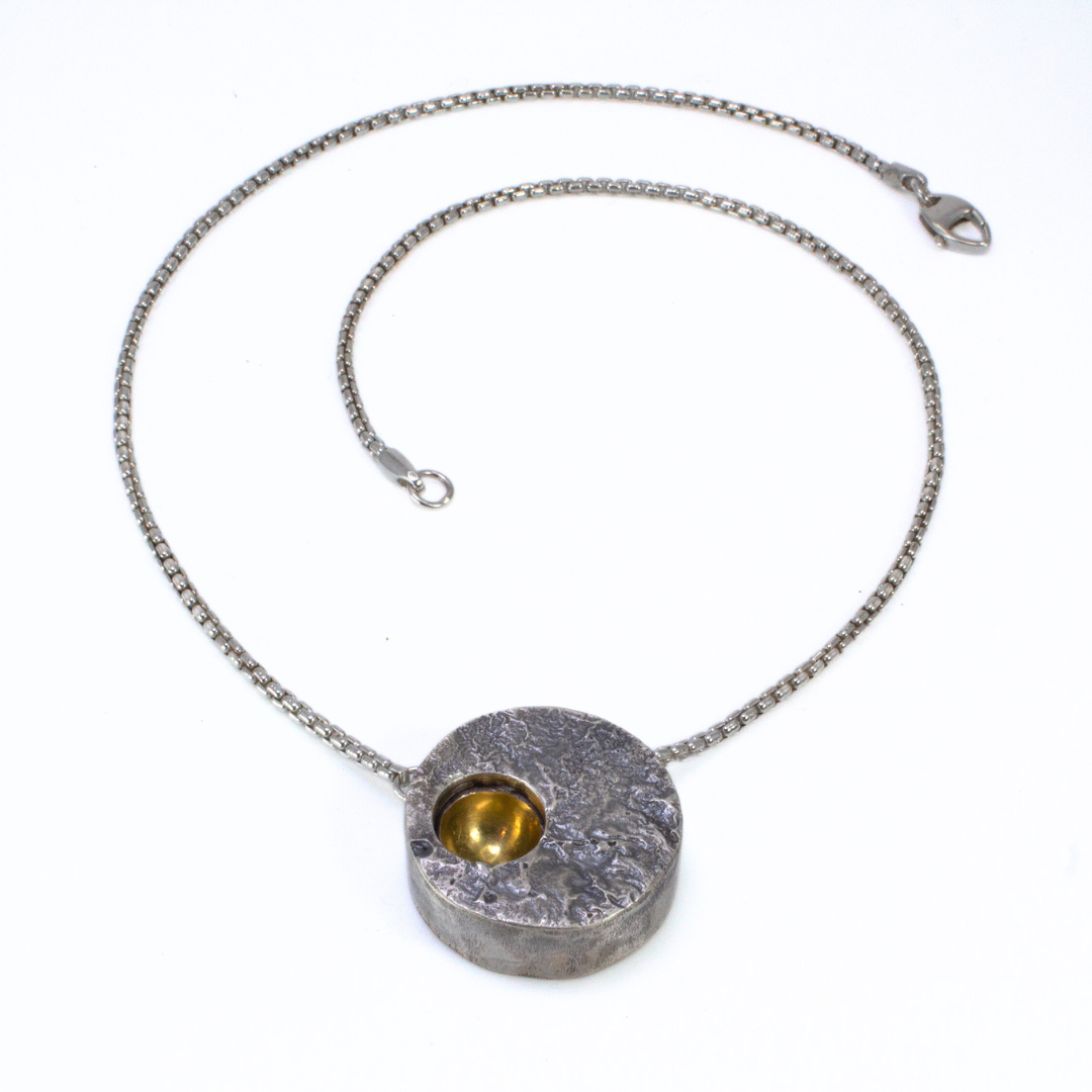 "That's No Moon!" - Reversible Hollowform Necklace in Silver, 22k gold, and Mokume Gane