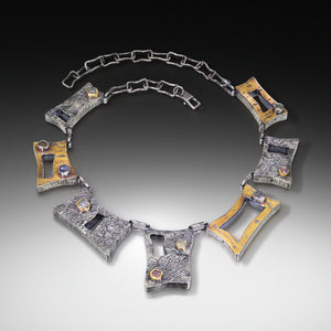 "Nilama Ta'igara (Sapphire Tiger)" - Hollow form necklace with raw sapphires